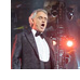 Singer Andrea Bocelli sings from a stage at the Coliseum in Rome