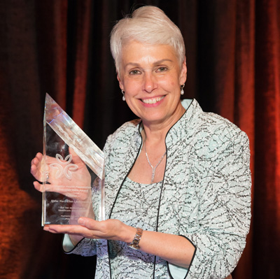 Sister Mary Ellen Leciejewski, this year's winner, holds her award