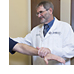 Dr. Jeremy Shefner with a patient