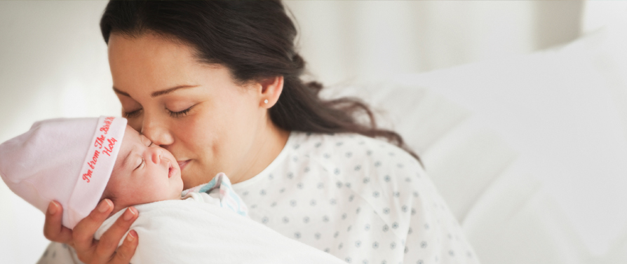 mother holding newborn baby
